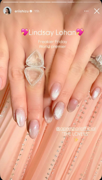 Lindsay Lohan wears a pastel pink catseye magnetic manicure.