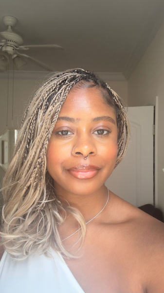 Image may contain Face Head Person Photography Portrait Adult Accessories Jewelry Necklace Hair and Appliance