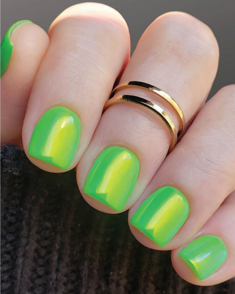 Short iridescent lime green neon nails.