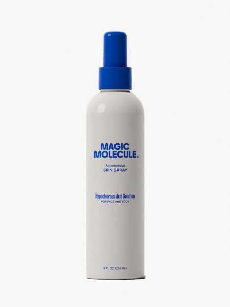 A white spray bottle of Magic Molecule Daily Antimicrobial Skin Spray with a bright blue cap on a light gray background